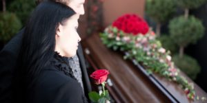 People at Funeral with coffin